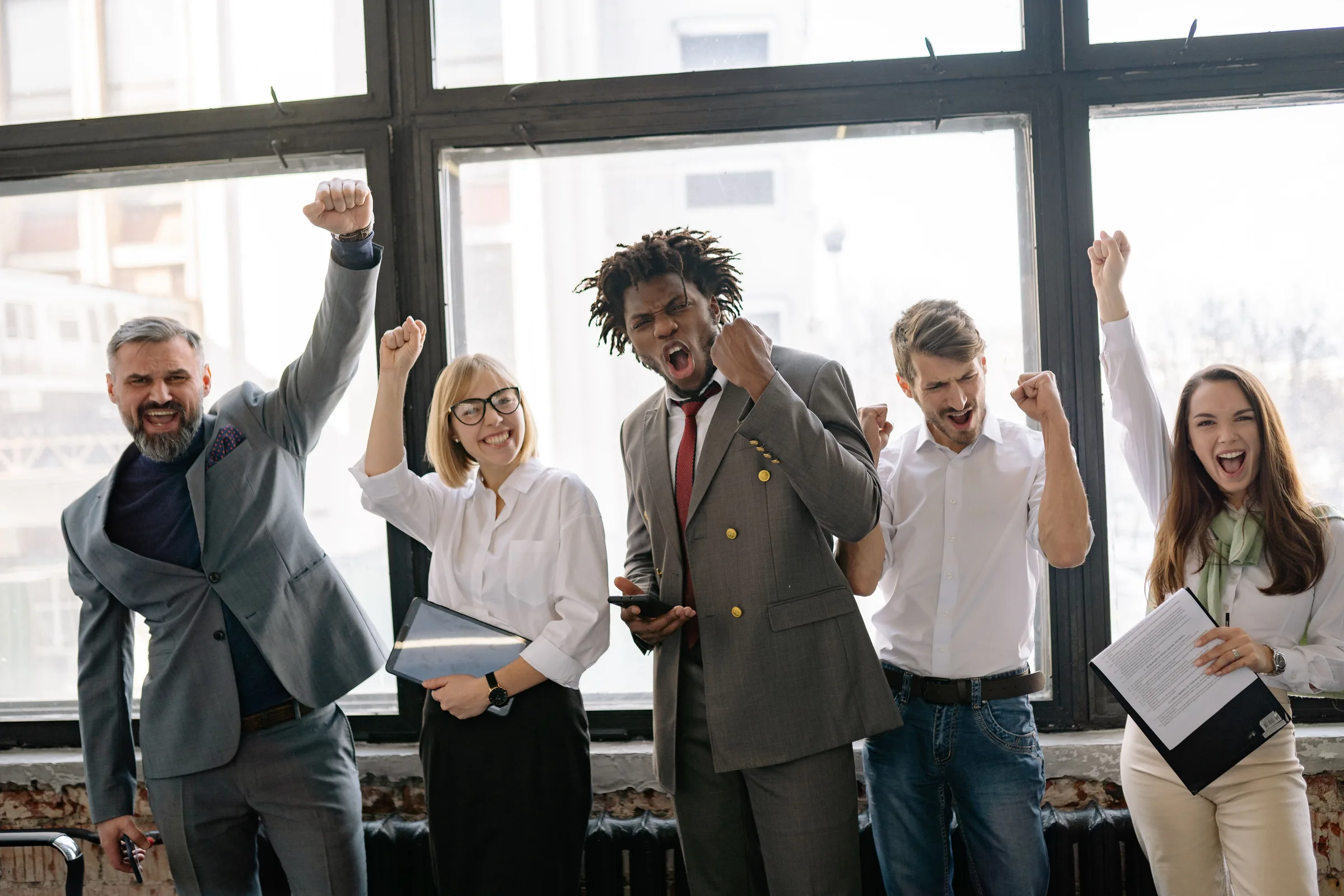 MASExam corporate exam prep success team celebrating in a modern office